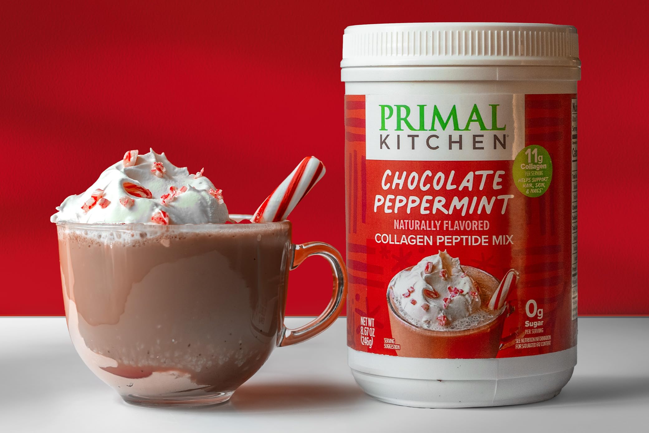 Measuring scoop dispensing Primal Kitchen collagen powder for precise servings