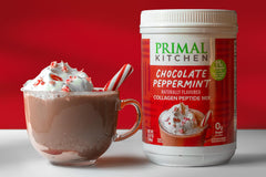 Measuring scoop dispensing Primal Kitchen collagen powder for precise servings