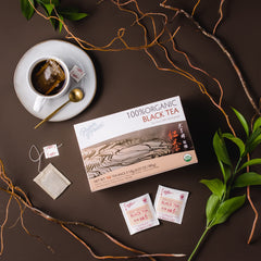 Cup with Prince Of Peace Organic Black Tea steeping, smooth aroma and warmth