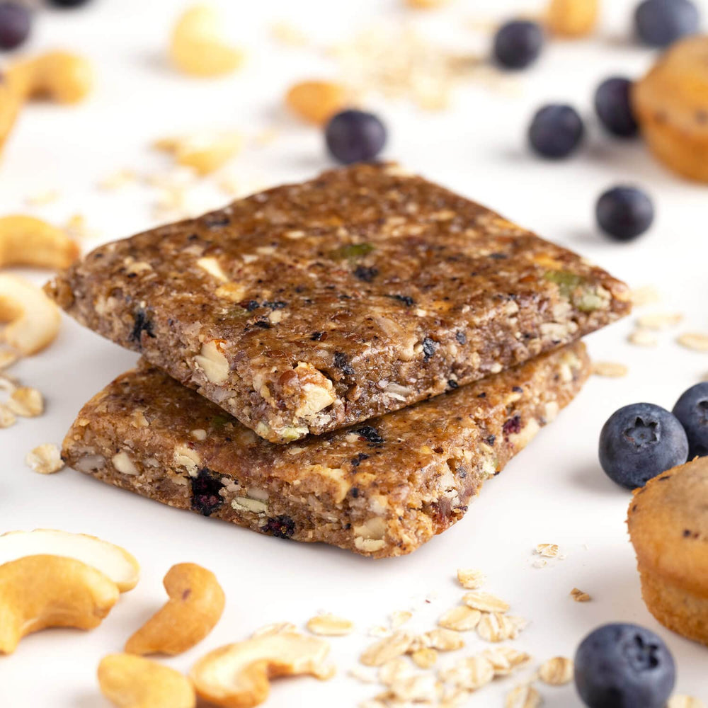 Close-up of Probar MEAL Bar Blueberry Muffin with oats and nuts for sustained energy.