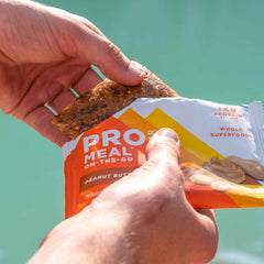 PROBAR MEAL Bar wrapper – Non-GMO verified with gluten-free badge on packaging.
