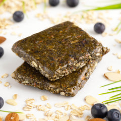 PROBAR MEAL Bar Superberry & Greens bite highlighting chewy texture for quick energy.