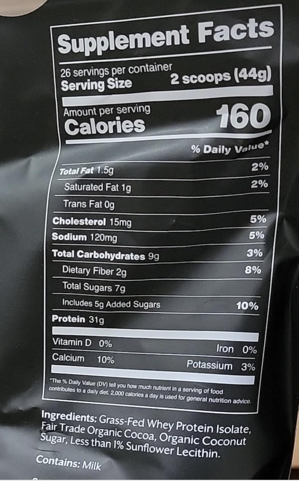Promix Whey Isolate Chocolate ingredients close-up featuring organic cocoa and grass-fed whey.