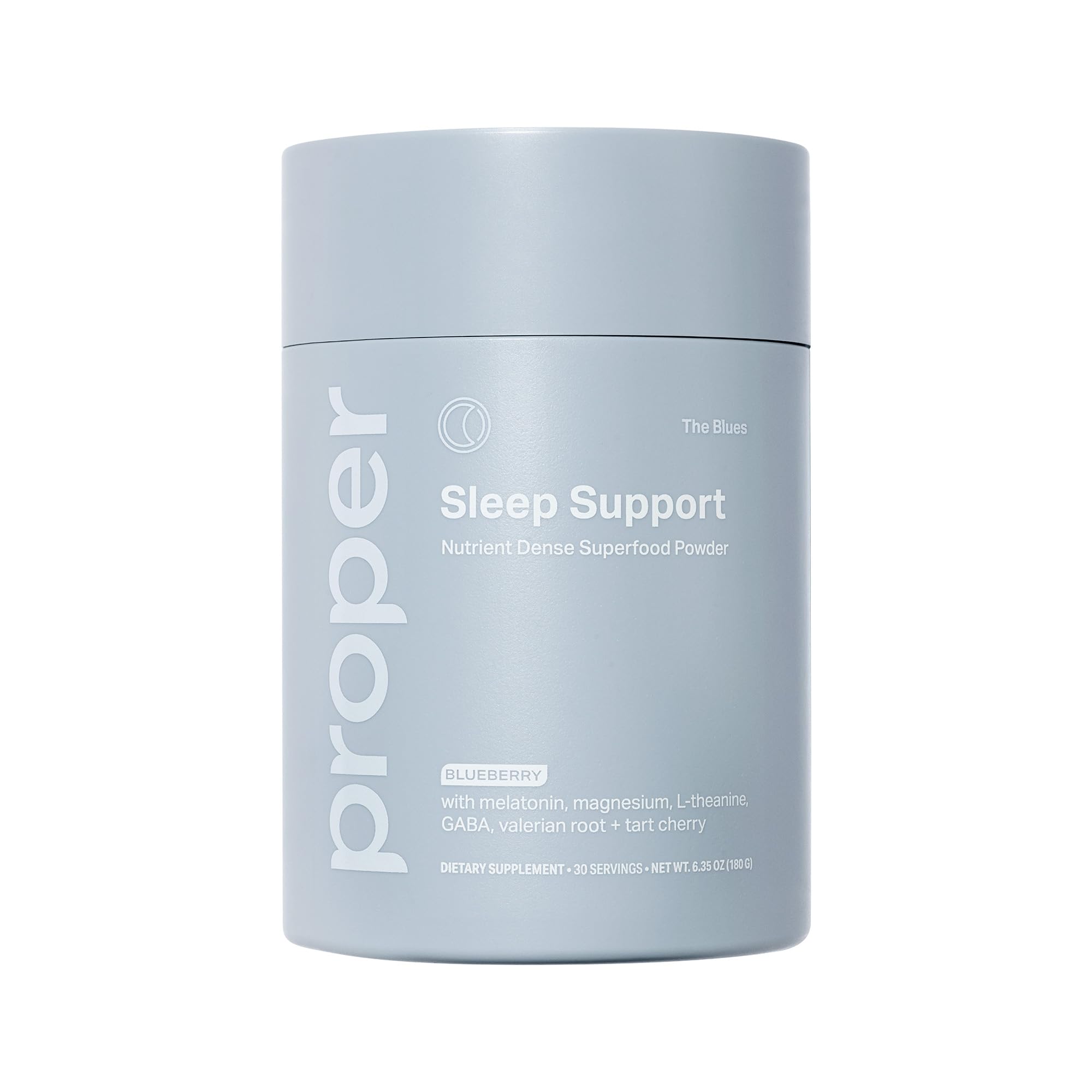 Proper Blues Sleep Aid powder being stirred in water for relaxation and bedtime routine.
