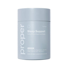 Proper Blues Sleep Aid powder being stirred in water for relaxation and bedtime routine.