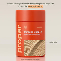 Proper The Oranges powder dissolving in water reveals a bright citrus color.