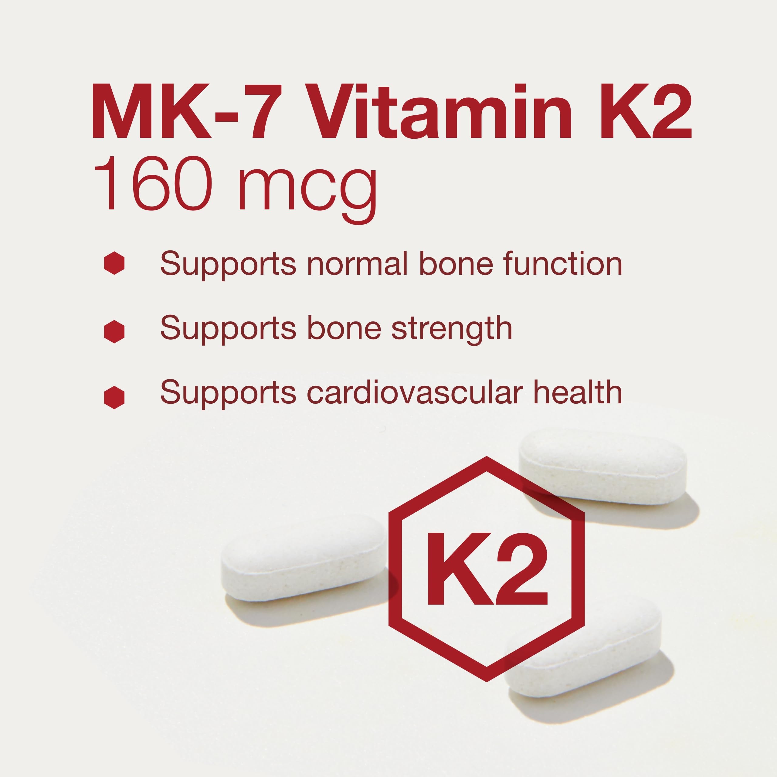 Assorted MK-7 tablets laid out to illustrate a simple daily supplement routine.