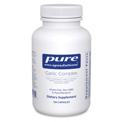 Pure Encapsulations Garlic Complex bottle on a kitchen counter for daily immune support.