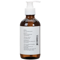 Arnica Oil bottle label closeup emphasizing all-natural, paraben-free formula.
