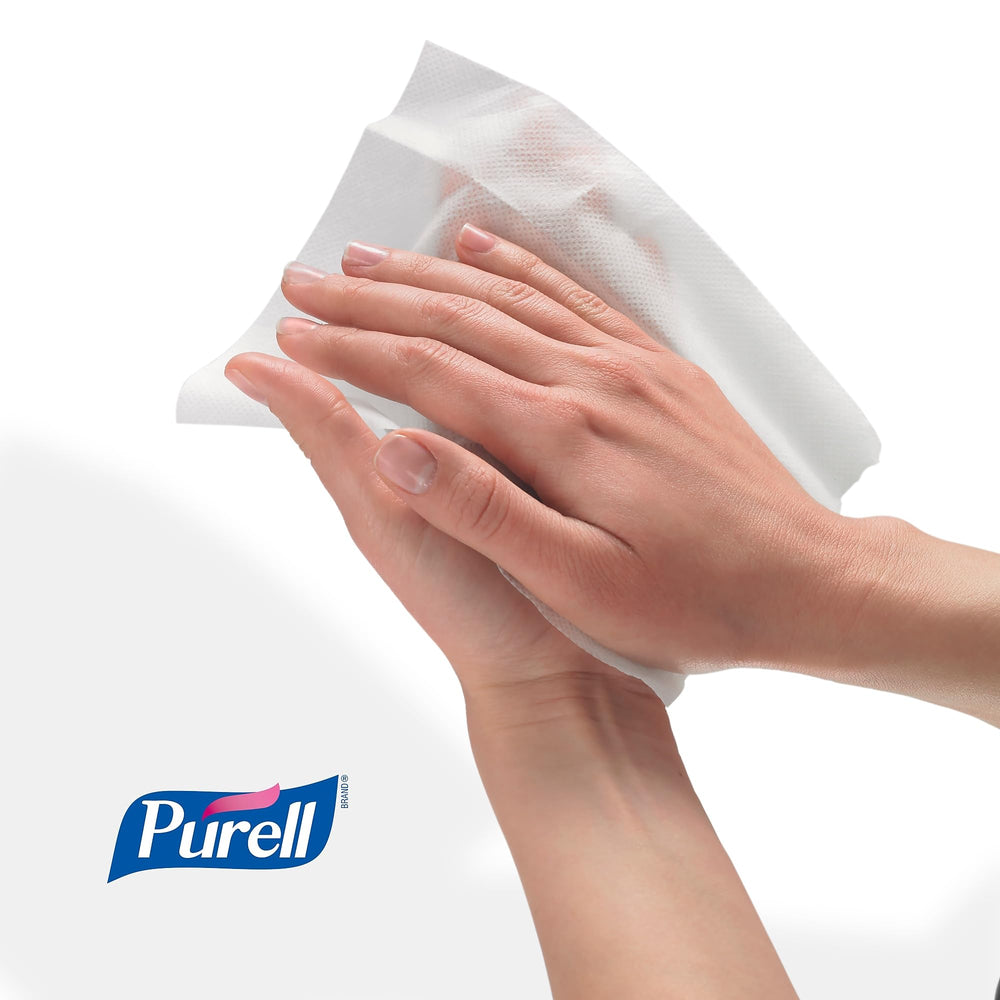 Close-up of a thick, textured Purell wipe ready for cleaning