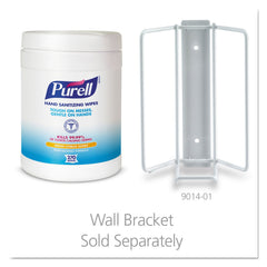 Hotel reception desk with Purell wipes for guest use.
