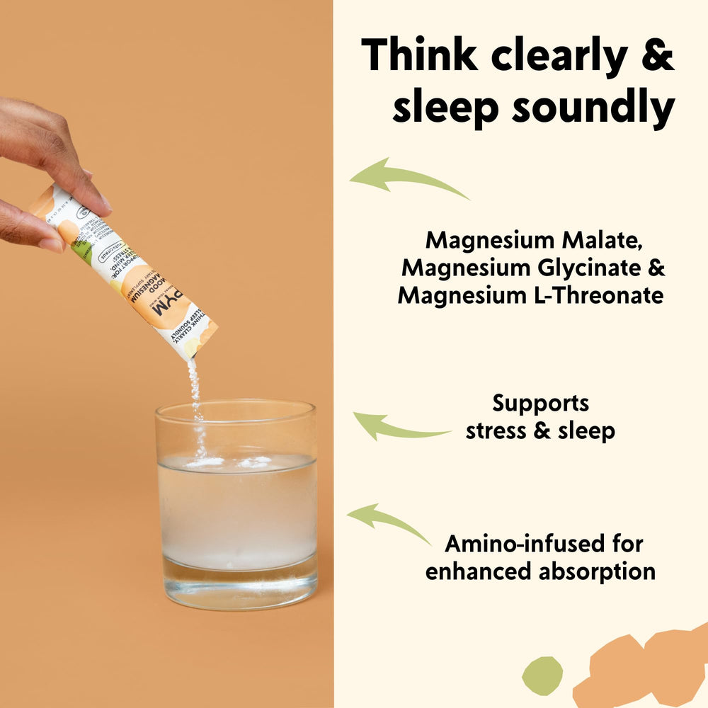 Pouring PYM Mood Magnesium packets into water for a quick citrus drink.