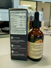 Label close-up on Q'ankyaq Leucine HMB liquid drops with clear ingredients.