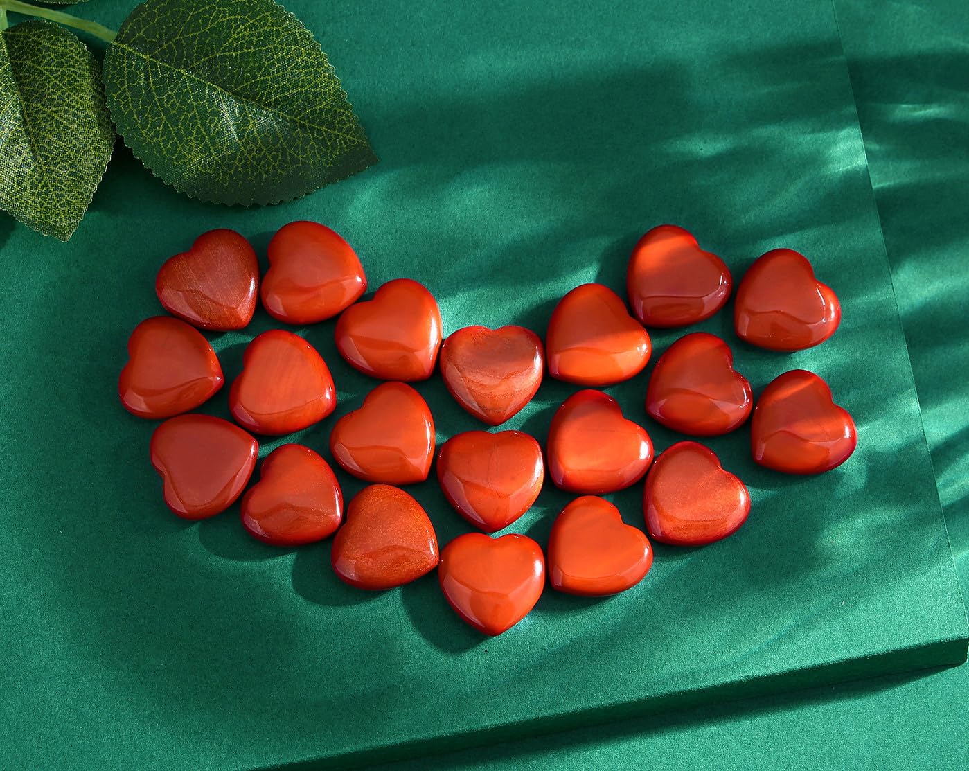 QINJIEJIE red jasper heart stone held for meditation and balance.