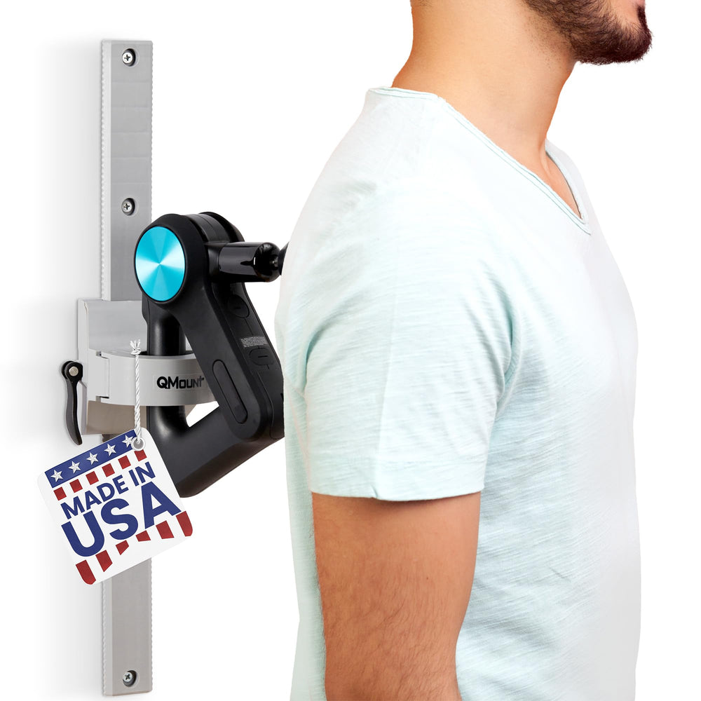QMount back massager wall mount holds the massage gun for hands-free use.