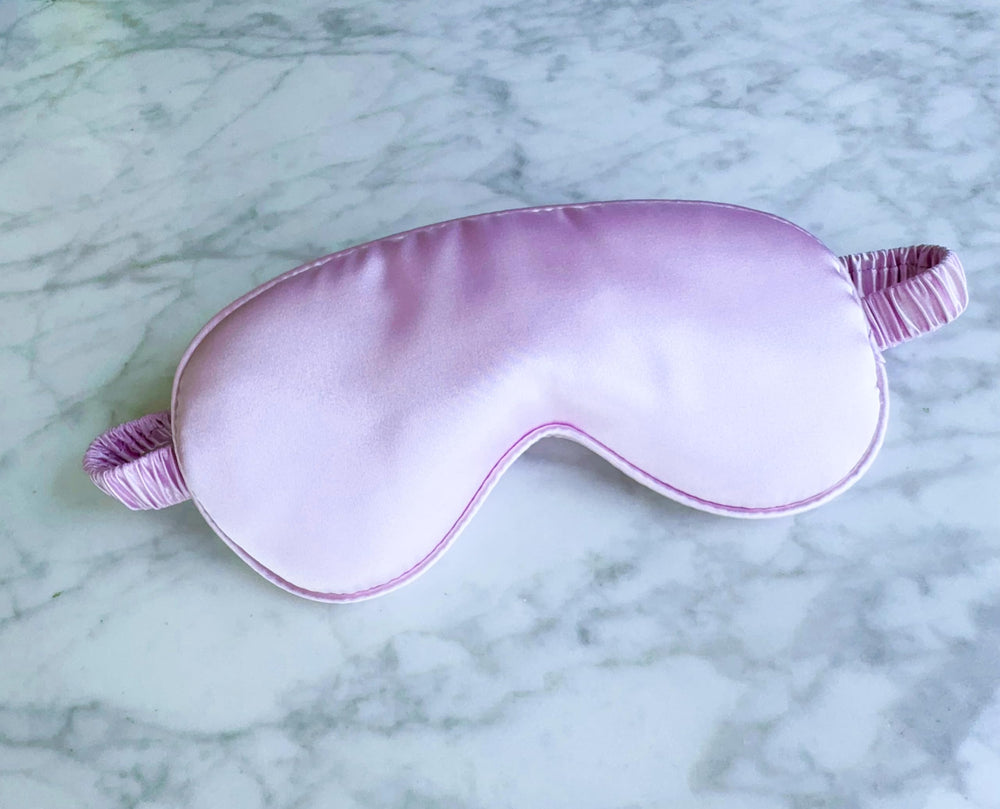 QSYW silk eye mask with breathable inner side for comfortable travel and rest.