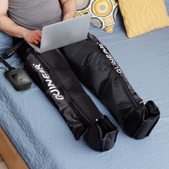 QUINEAR recovery boots secured on legs with targeted compression
