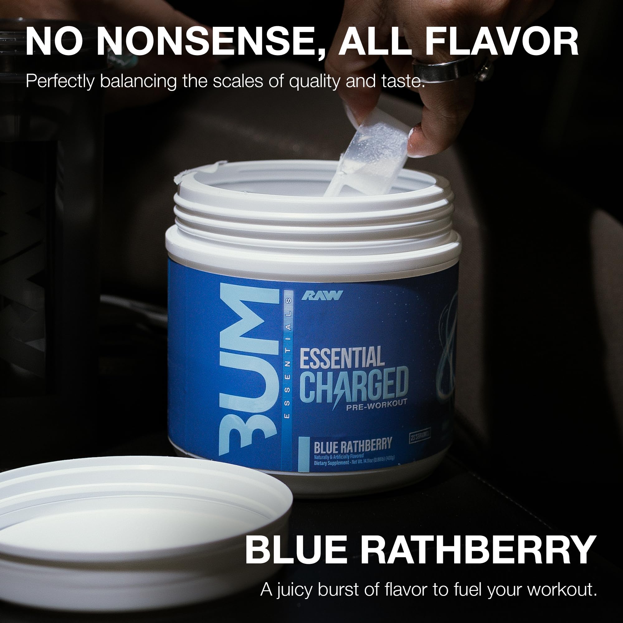 Pouring RAW Essential Charged blue raspberry pre-workout before training