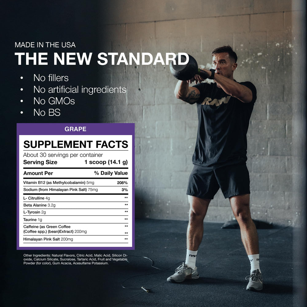 Pouring RAW Essential Pre-Workout Grape drink for pre-workout energy.