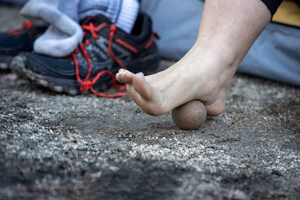 Rawlogy cork massage ball in a compact travel setup for gym and office routines.