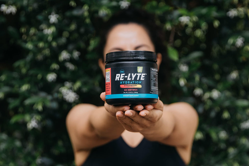 Hydration-ready setup with bottle and powder for travel or gym use.