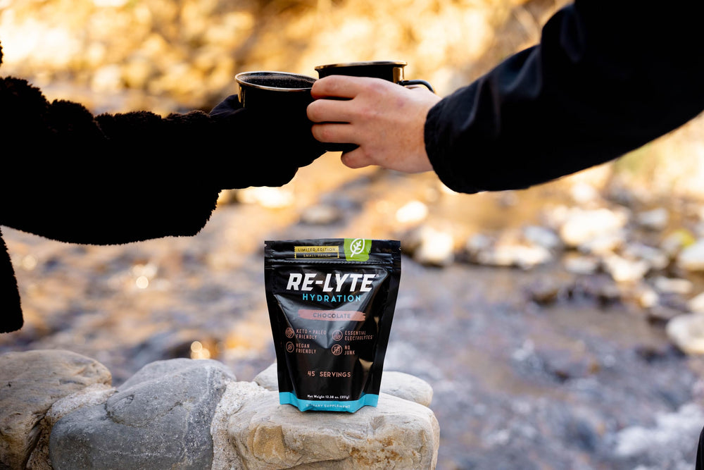 Redmond Re-Lyte chocolate in a cozy mug suggesting a comforting hydration ritual