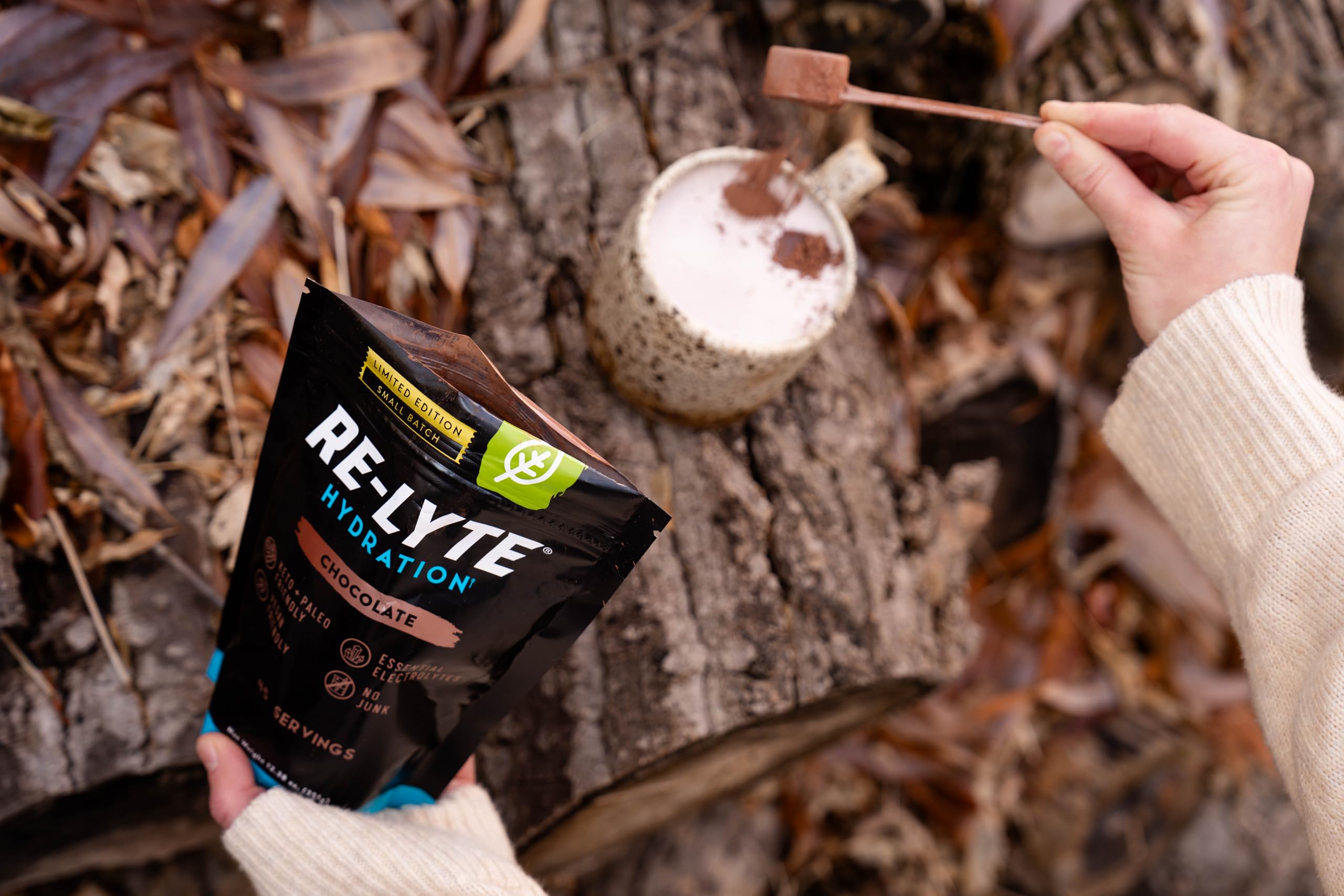 Redmond Re-Lyte chocolate being stirred on the go for portable hydration
