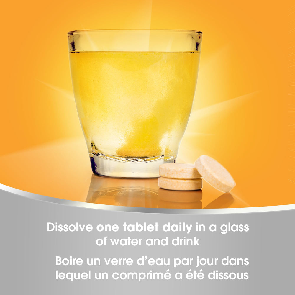Redoxon Orange tablet held in hand ready to dissolve