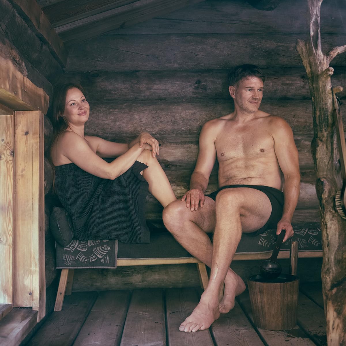 Rento Birch Sauna Oil in water enhances steam with forest notes.