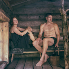 Rento Birch Sauna Oil in water enhances steam with forest notes.