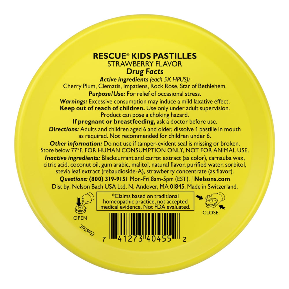 Close up of RESCUE Kids Pastilles strawberry lozenge on hand