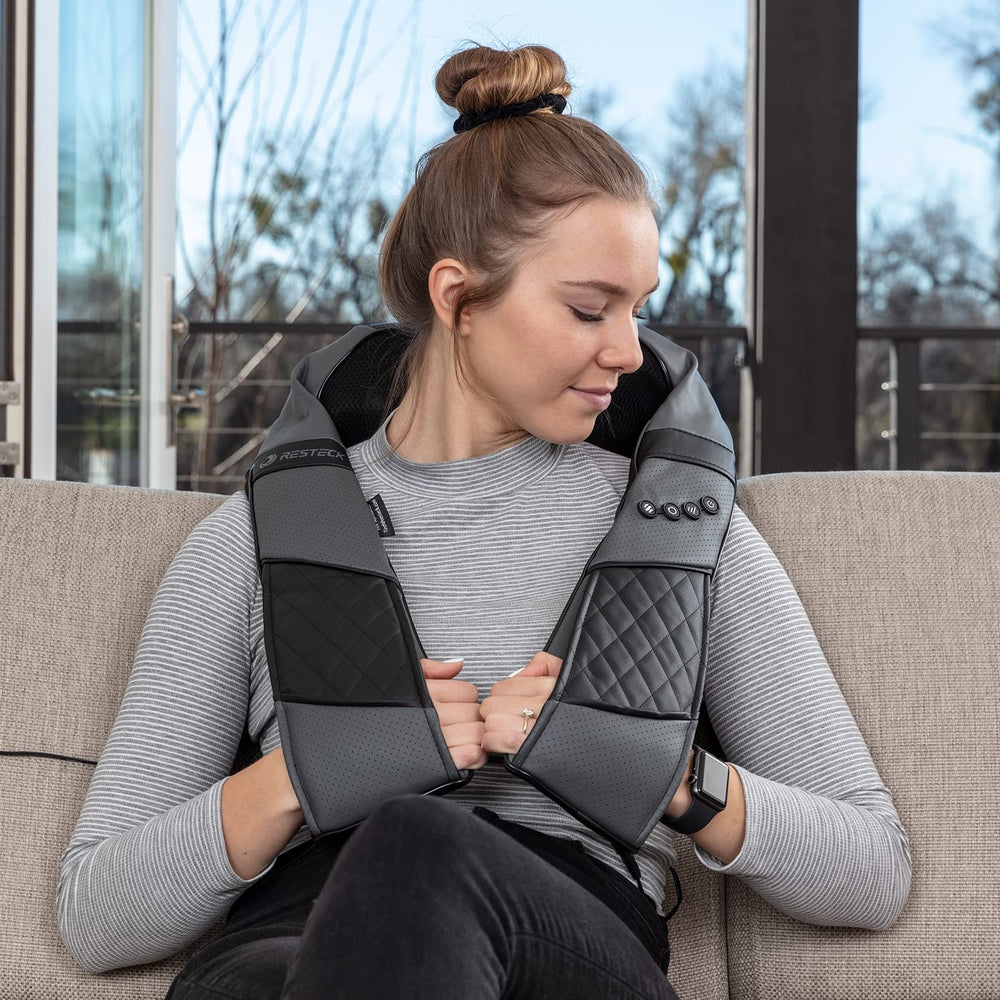 RESTECK portable massager with car adapter for travel relief.