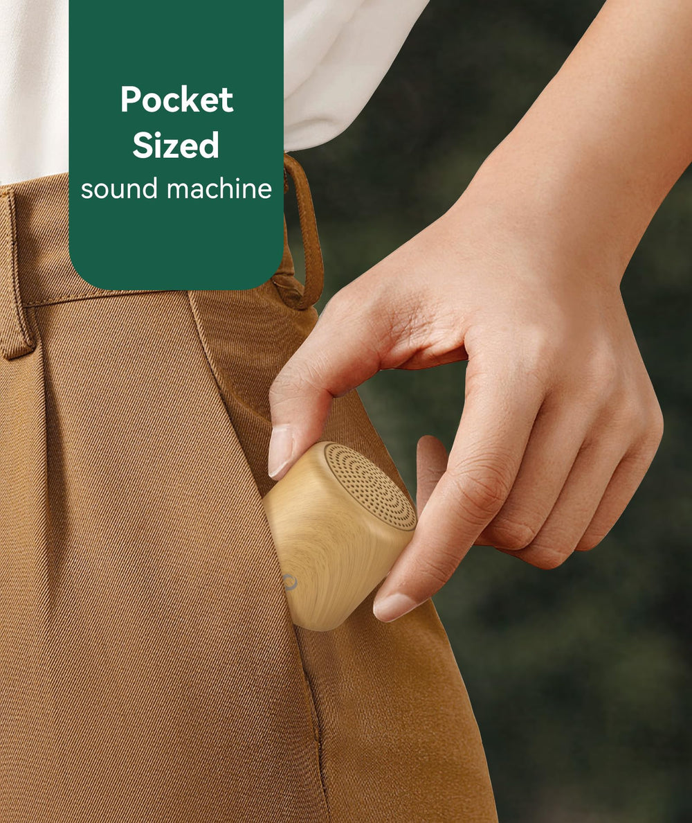 Restnature portable sound machine in use beside nightstand for bedtime calm.