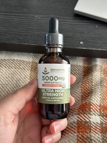 Restorative Botanicals label closeup shows organic certification and 5000mg strength.