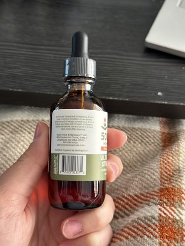 Restorative Botanicals mandarin orange bottle supports daily calm and focus.