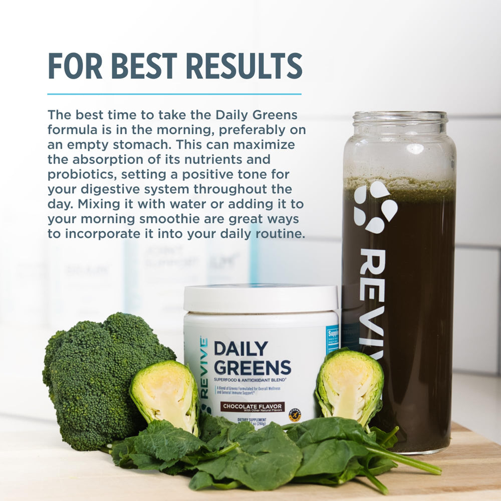 Revive MD Daily Green Powder scoop beside a prepared shake for a convenient daily boost.