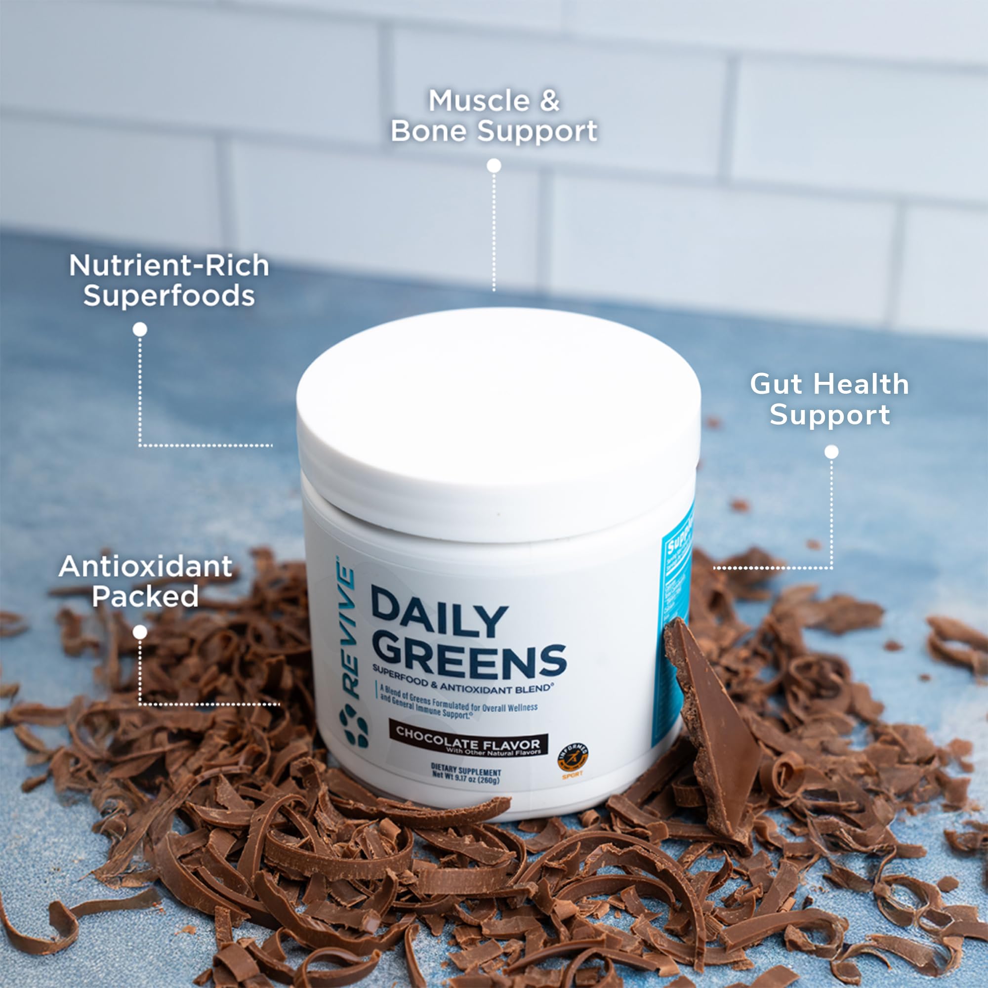 Revive MD Daily Green Powder shake glass with chocolate flavor for plant-based energy.