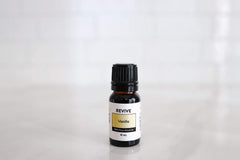 REVIVE Vanilla Oleoresin diffuser bottle shows calming scent for relaxing spaces.