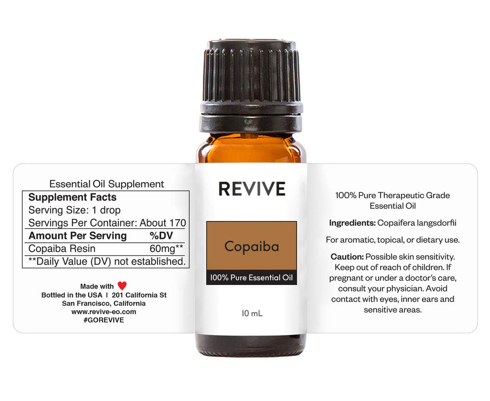 REVIVEEO Copaiba essential oil in diffuser setup creates a soothing aromatic atmosphere.
