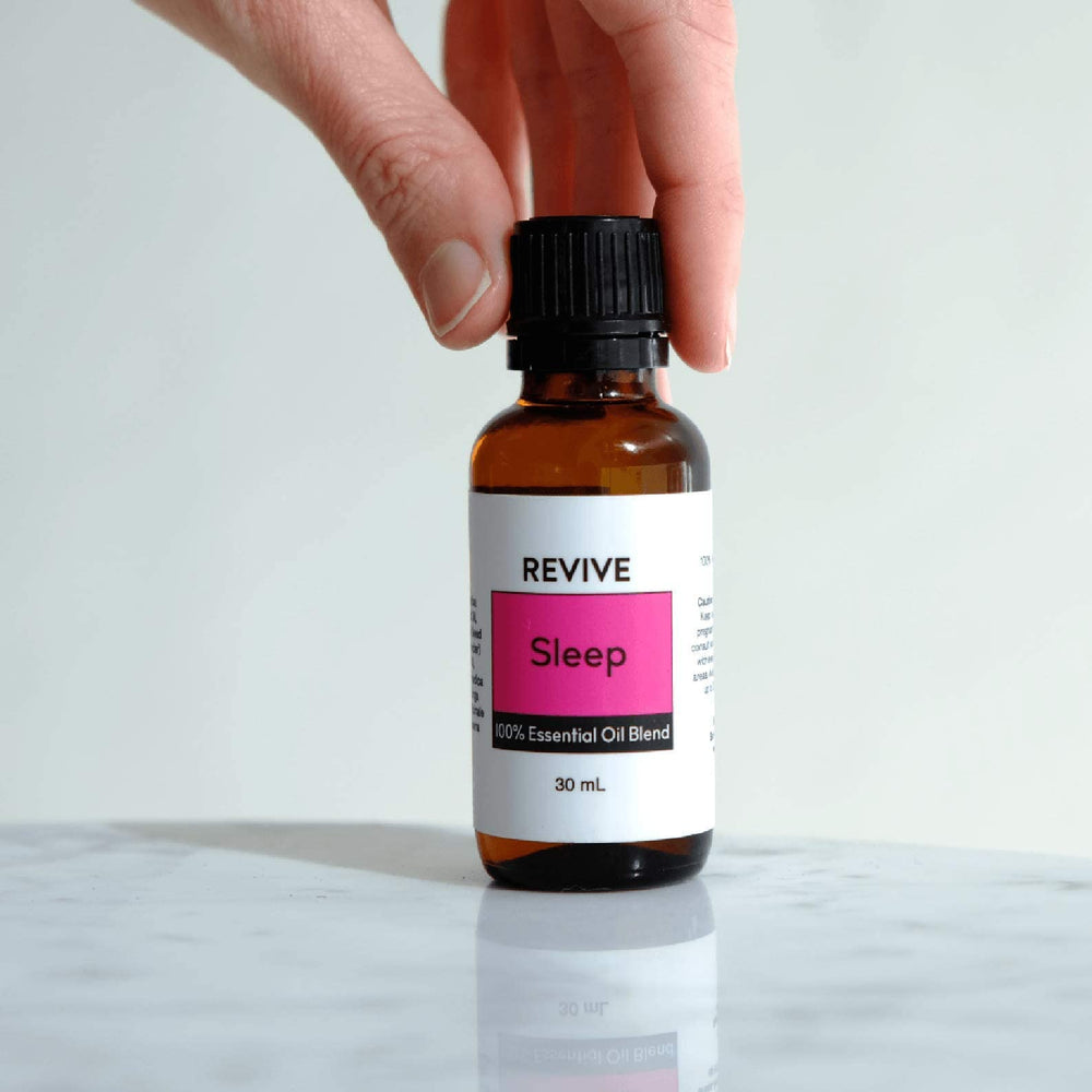 REVIVEEO Sleep bottle on nightstand ready for nightly routine.