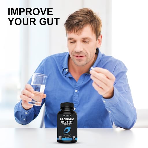 Revive Herbs capsules in hand, easy-to-swallow daily probiotic for men and women.