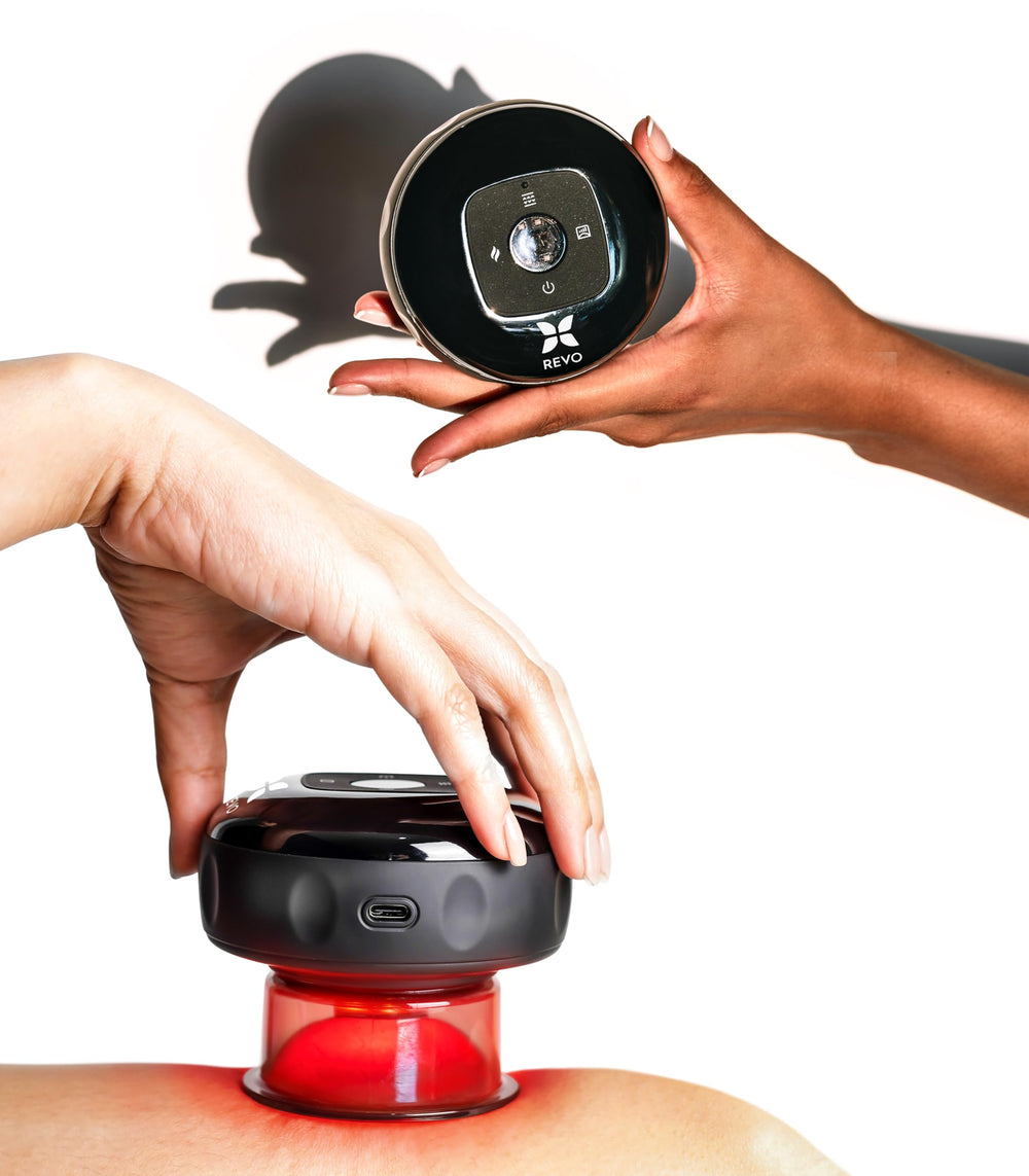 REVOMADIC REVO cupping massage device used on back to relieve tension and promote relaxation.