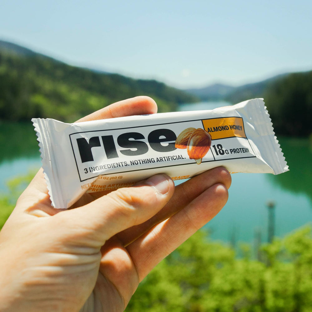 Rise almond honey bar sits on the counter for a healthy snack.