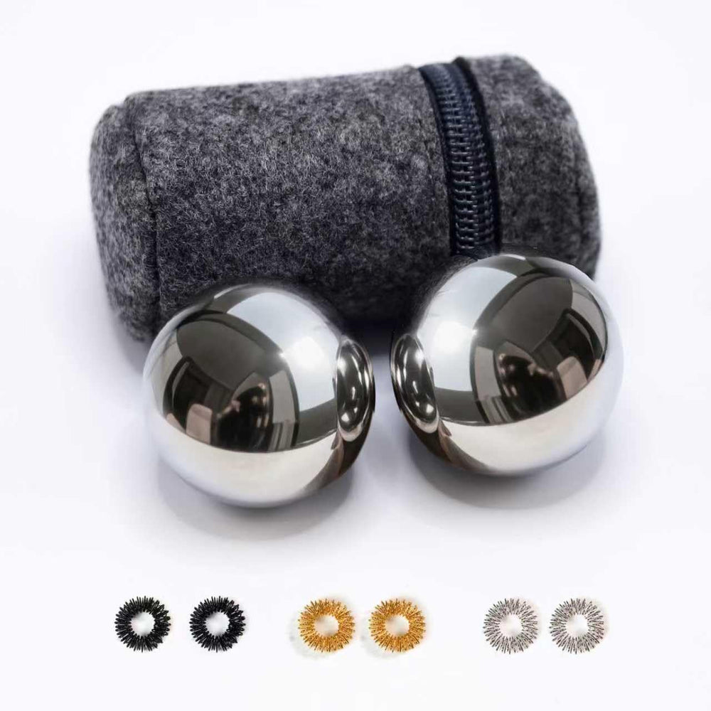 Roadtofree chiming Baoding ball in palm for calming focus.
