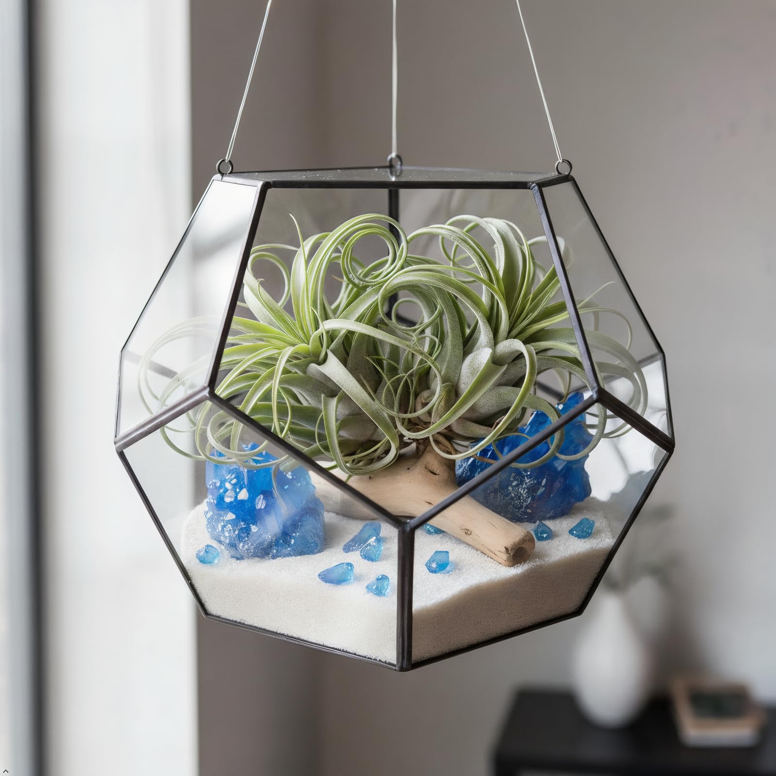 Rockcloud titanium-coated blue quartz geode cluster, enhances display on shelves.