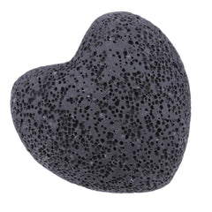 Pocket-friendly lava heart stone held in hand for grounding moments.