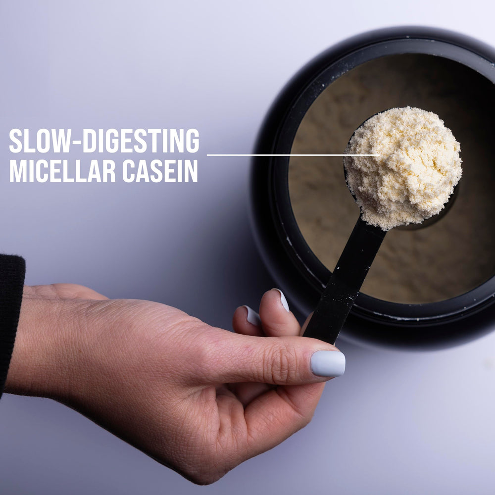 Rule 1 Casein Protein Vanilla Creme bottle with glass for between-meal fueling