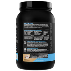 Rule 1 Proteins Whey Protein scoop beside container for easy mixing