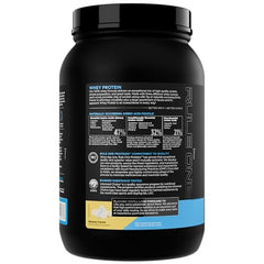 Close-up of Rule 1 Whey Protein powder showing creamy texture and powder consistency.