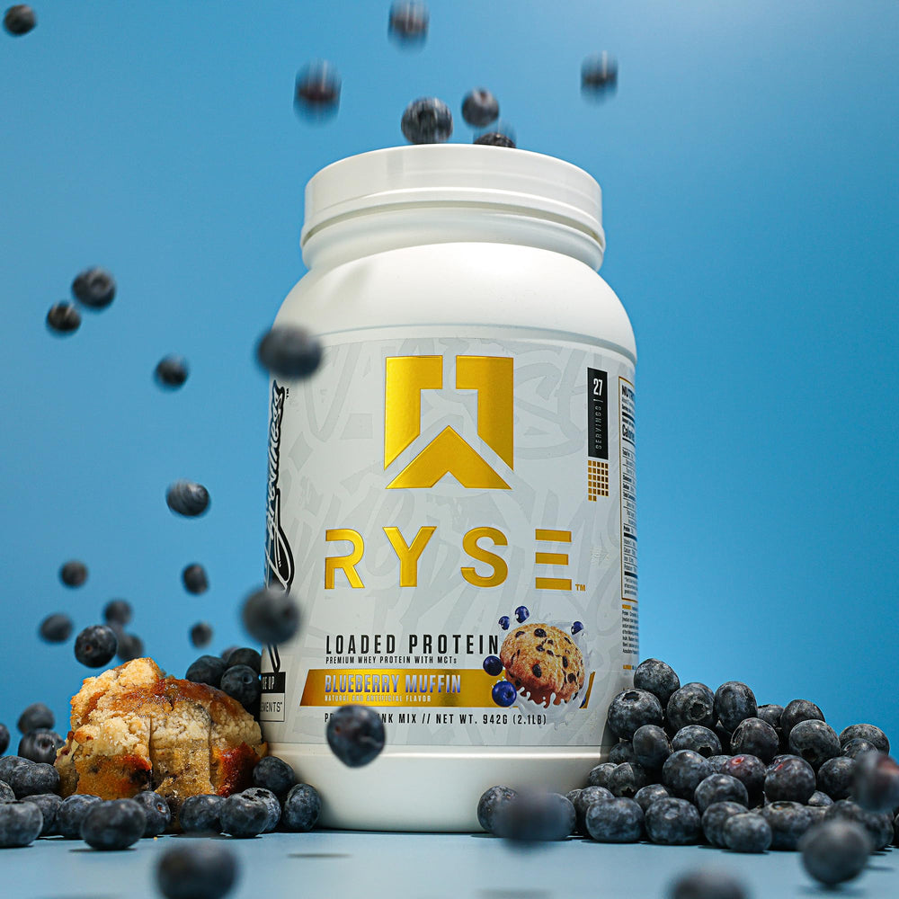 Scoop of RYSE Loaded Protein ready to dissolve in liquid for a shake.